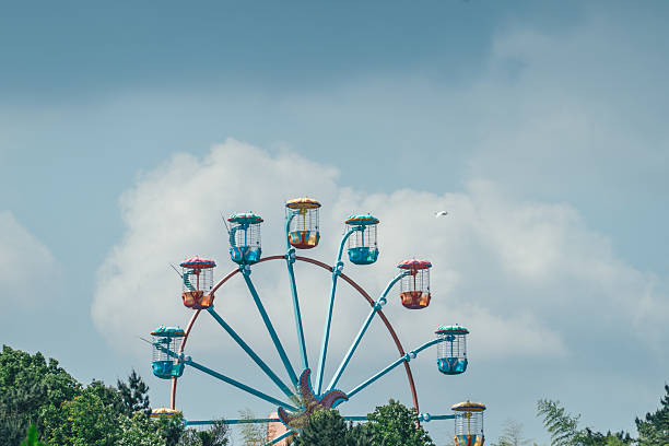 istock Carnival ferris wheel on blue sky background 2218879336