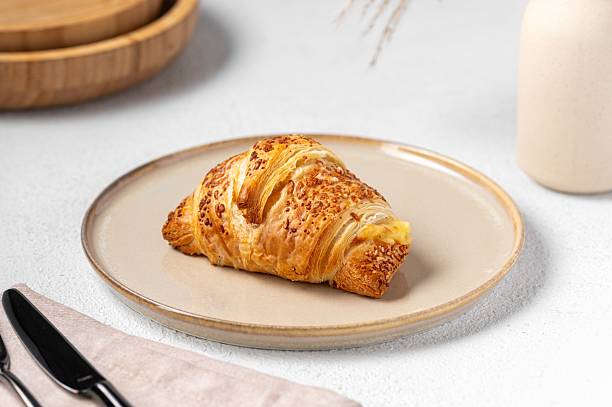 istock Delicious croissant on a ceramic plate. 2218879453