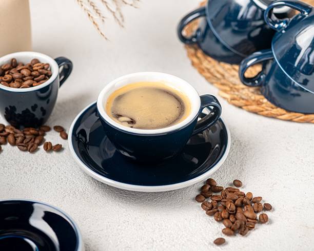 istock Freshly brewed coffee with beans and blue cups. 2218879468