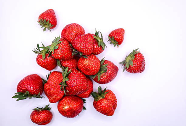 istock Fresh red strawberries isolated on white background 2218879678