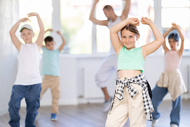 istock Tween girl dancer rehearsing krump dance at group workout 2218885237