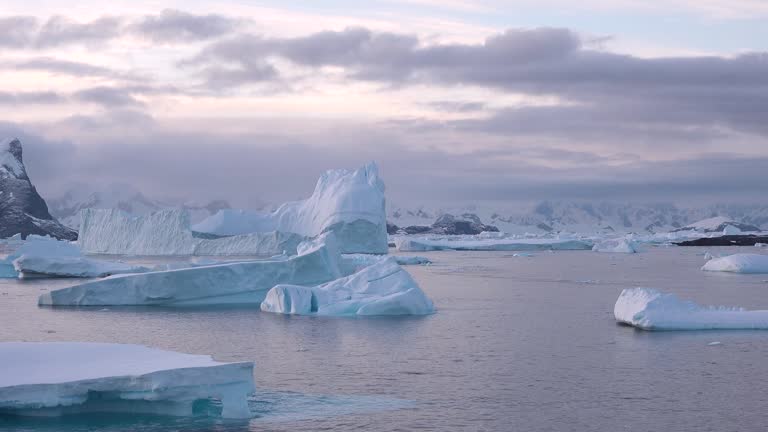Melting icebergs and glaciers in polar regions highlight the impact of global warming on the environment. Large areas of water expose the consequences of climate change.