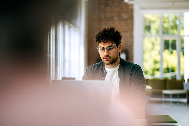 istock Businessman working on laptop at modern office 2218887785