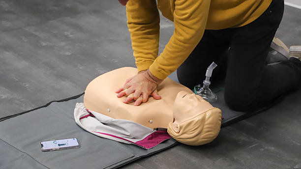 istock first aid course - company safety - cardiac massage - Basic Life Support 2218887927