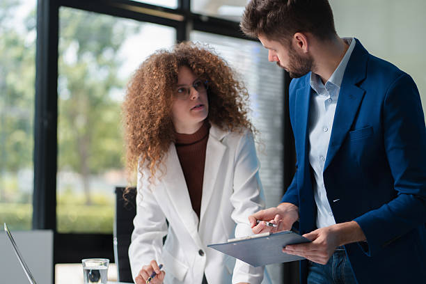 istock Diverse professionals collaborate on project analysis with financial graphs. Strategic teamwork and insights drive company growth and success. 2218888926