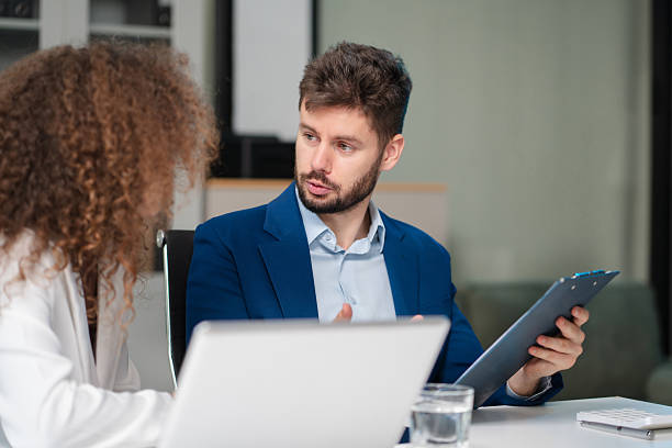 istock Diverse professionals collaborate on project analysis with financial graphs. Strategic teamwork and insights drive company growth and success. 2218888930