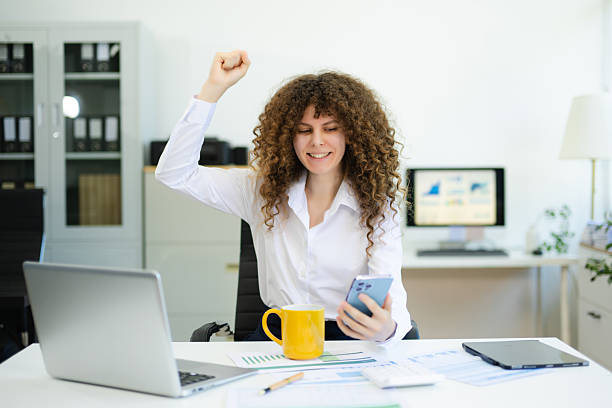 istock Young businesswoman working with working notepad, tablet and laptop documents talking on the smartphone, tablet 2218890050