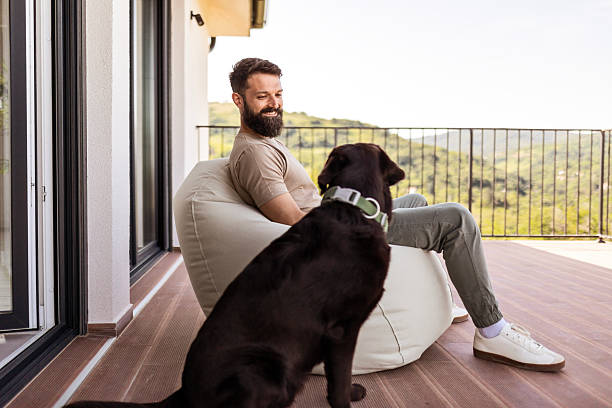 istock Relaxing on Porch with Coffee and Labrador Joy 2218890561