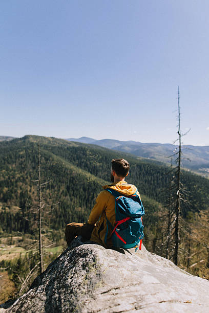 istock Adventurous Hiker Enjoying Scenic Cliffside View During Weekend Getaway 2218891214