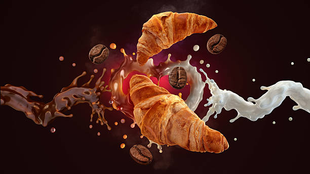 istock Croissants, coffee beans, and splashes of milk and coffee dynamically arranged against a dark background 2218891663
