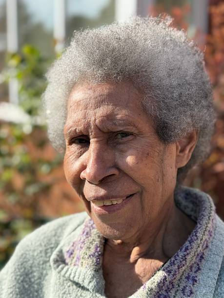 istock Elderly black lady with grey Afro hair 2218894274