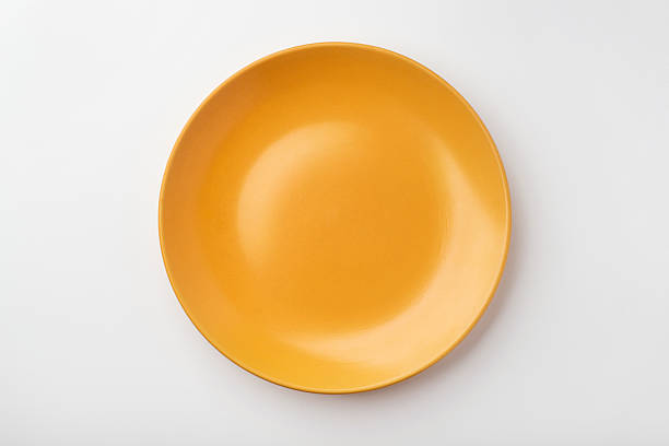 istock Yellow ceramic plate on a white background. 2218895223