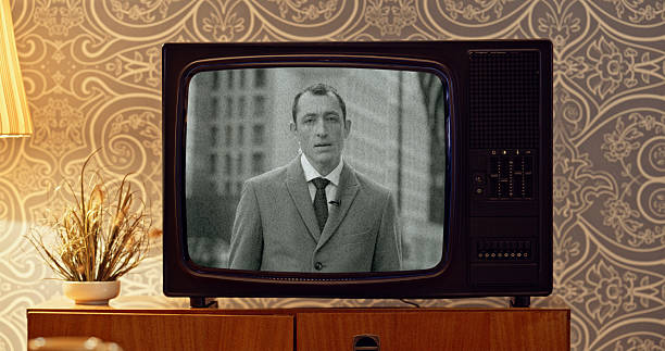 istock Vintage Television Broadcasting Black And White News Program Against Retro Wallpapered Wall 2218897908