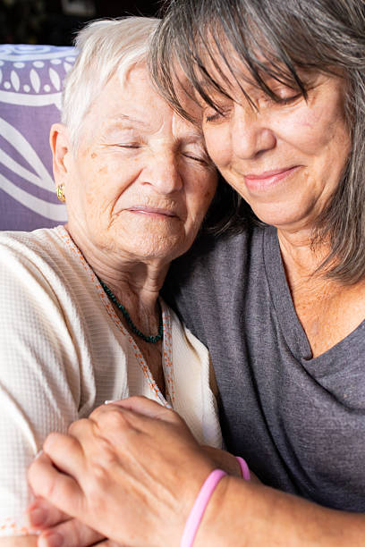 istock Daughter comforting elderly mother with cancer 2218898677