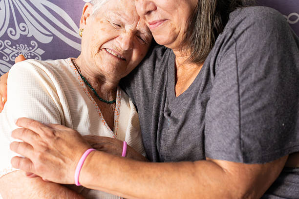 istock Daughter embracing elderly mother showing support and love 2218898867