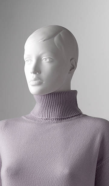 Still life of a mannequin face wearing a sweater