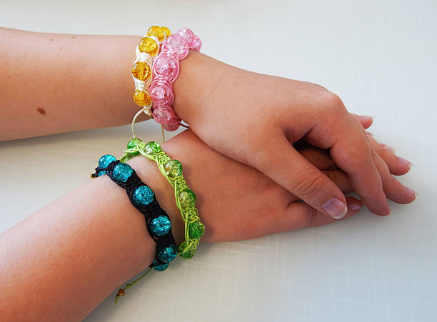istock Female hands with hippie bracelets 2218901685