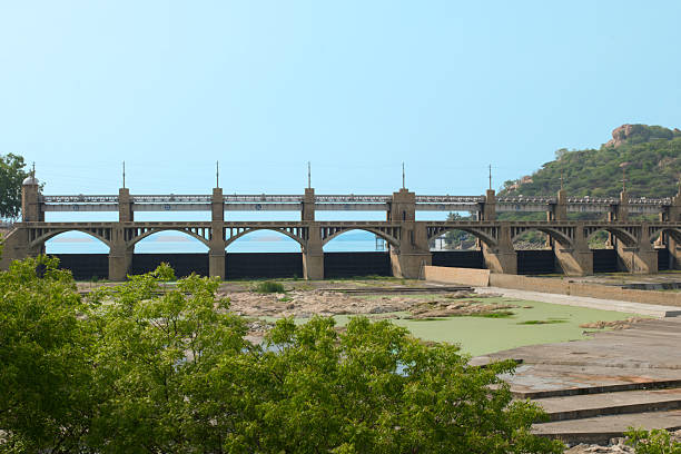 Historic concrete bridge over calm waters on a sunny day