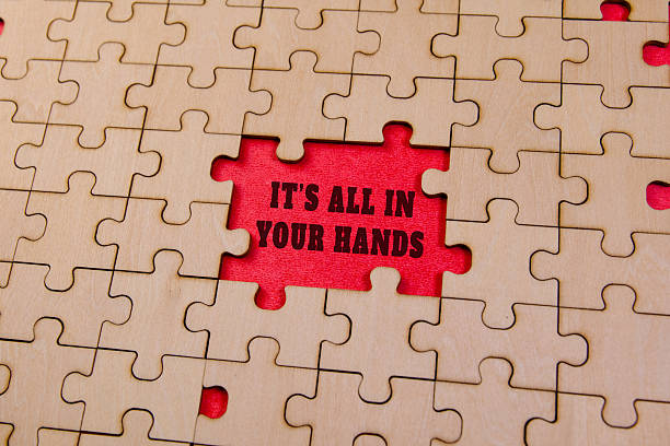 istock Motivational puzzle pieces on red background 2218901871