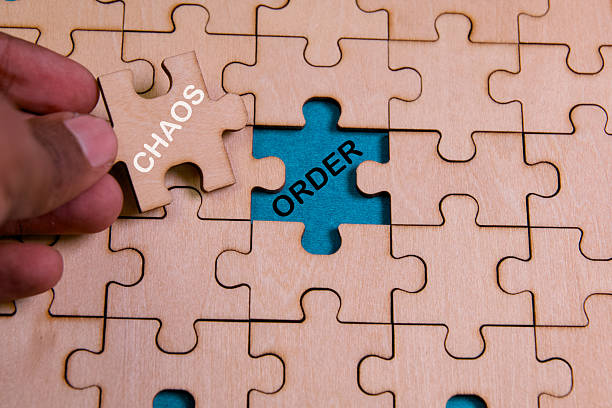 istock Puzzle piece representing chaos and order in a concept 2218902001