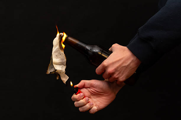 An image of street warfare and anarchy using a flammable mixture in a bottle