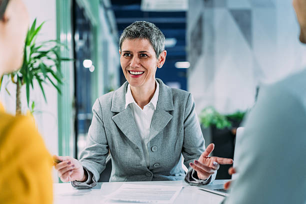 istock Group of business persons talking in the office. 2218910060
