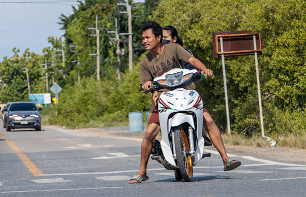 BANGKOK, THAILAND, JUNE 05 2022, The pair rides on motorcycle at the road
