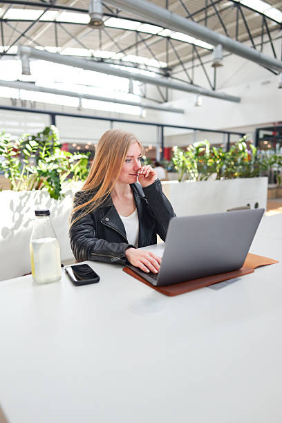 istock Productive atmosphere in open-plan office with greenery and natural sunlight. 2218916698