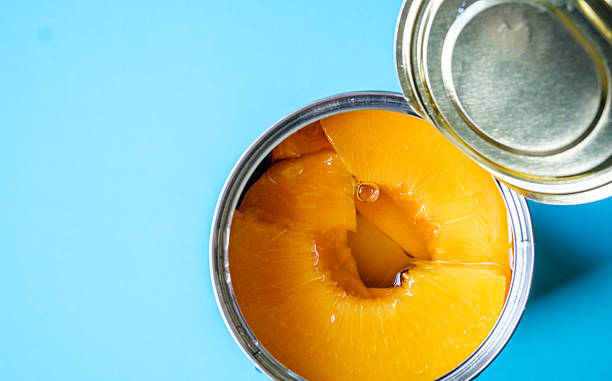 istock Open Tin Or Can Of Sliced Peaches Dessert Or Cooking Ingredients 2218920334