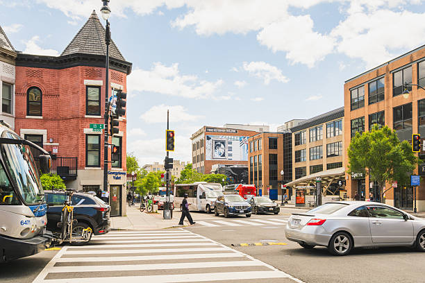 Washington D.C., USA, - May 24, 2025. Urban intersection bustling with traffic near 13th Street NW and U Street NW.