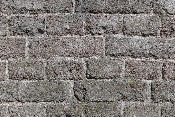 istock Detailed view of a weathered brick wall showcasing its rugged texture 2218925195