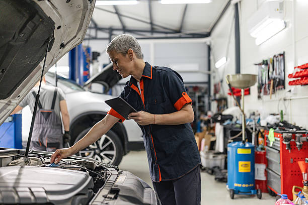 istock Mechanic detailing engine parts with digital device 2218928851