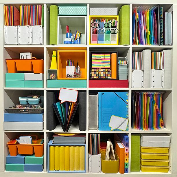 Home office storage shelves, packed with folders and boxes filled with office supplies
