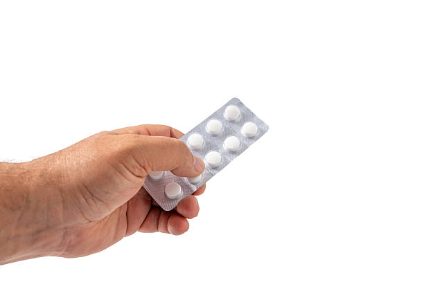 istock A hand holds a blister pack of chewable tablets, ready to use. 2218937515