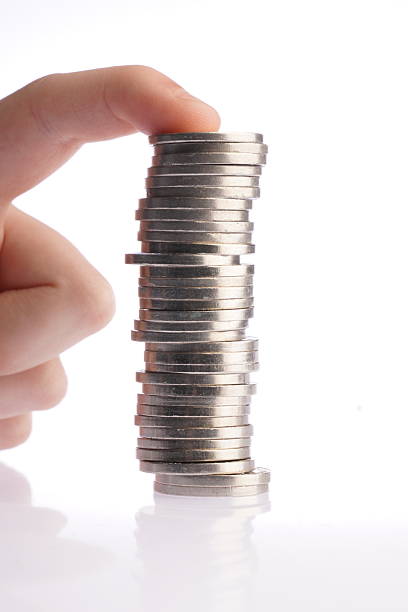 istock Hand holding stacked Argentine coins. 2218938548