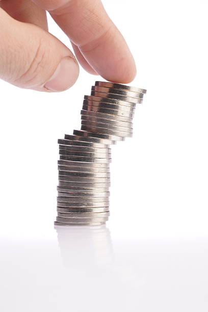 istock Hand holding stacked Argentine coins. 2218938564