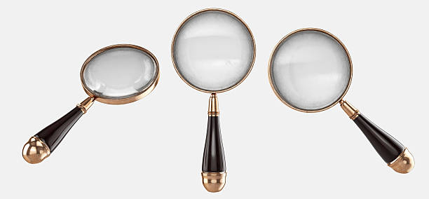 Optical instruments for magnification, featuring convex lenses and brass accents.