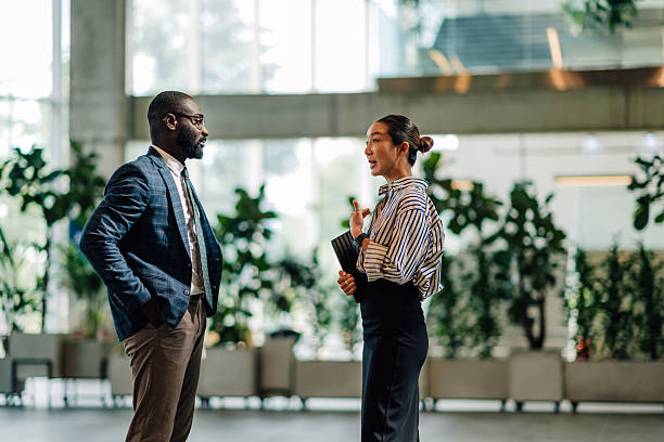istock Businesspeople discussing strategy in modern office building 2218947877