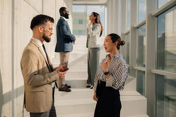 istock Businesspeople talking during break time in modern office 2218948580