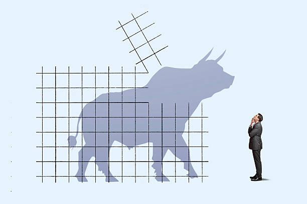 A man looks up at a bull market breakout.