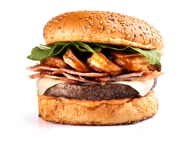 surf and turf burger with prawns, arugula, bacon, close-up