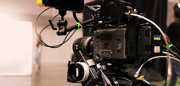 istock Professional cinema cameras being used in a studio or event setting.  High end gear with crew operation and behind the scenes video production in action. Camera for Live recording and broadcasting. 2218956001