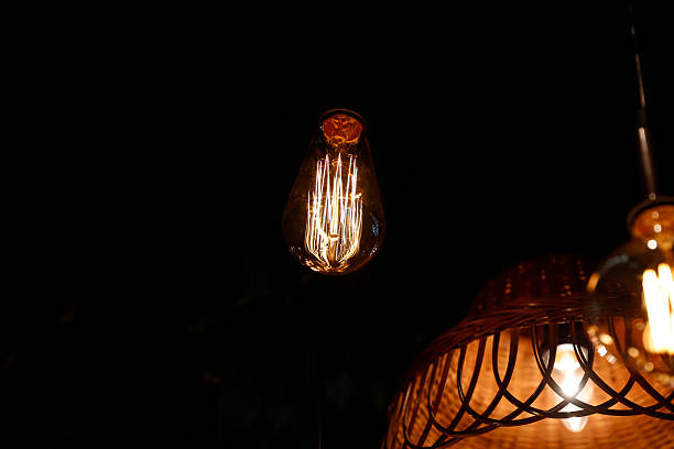 istock Warm glowing vintage halogen decorative bulbs on black background 2218956805