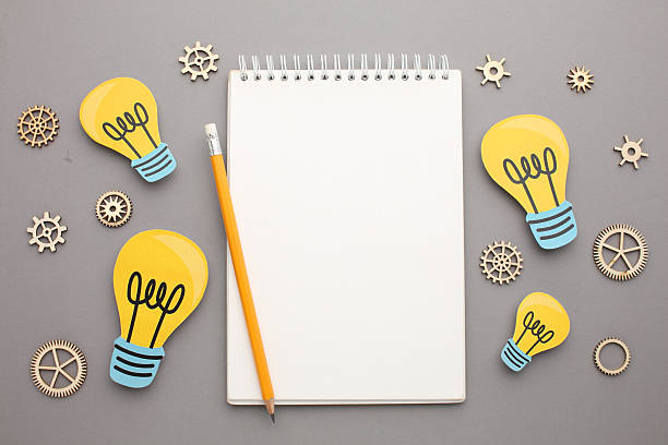 Creative thinking ideas and innovation concepts. Yellow coloured light bulb on the background. High quality photo