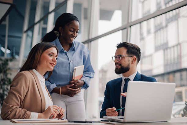 istock Business team collaborating on project using laptop in modern office 2218957605