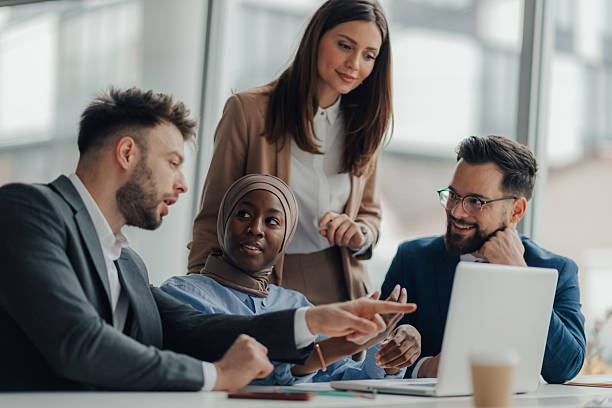 istock Business team discussing work on laptop in office 2218957829