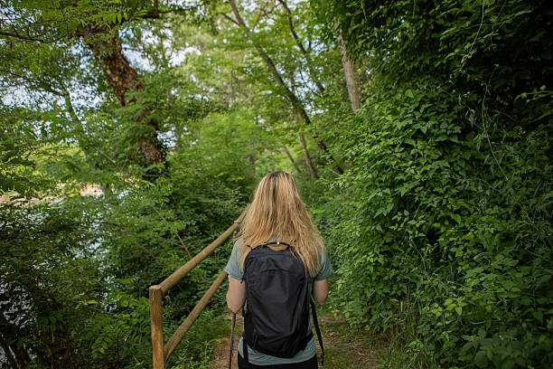 istock Woman walking along the path 2218963378
