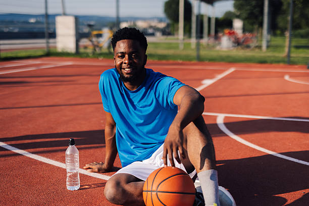 istock Basketball player resting after training on outdoor court 2218964167