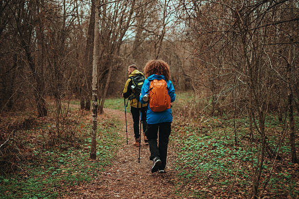 istock Hikers walking on trail in forest 2218965291