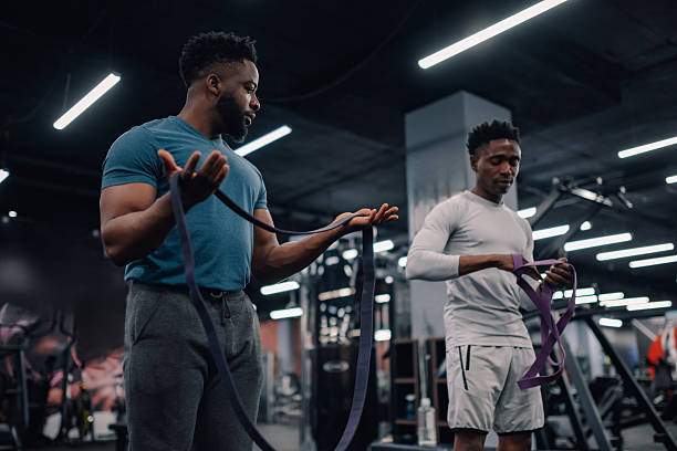 istock Two young men preparing resistance bands for fitness training 2218966820